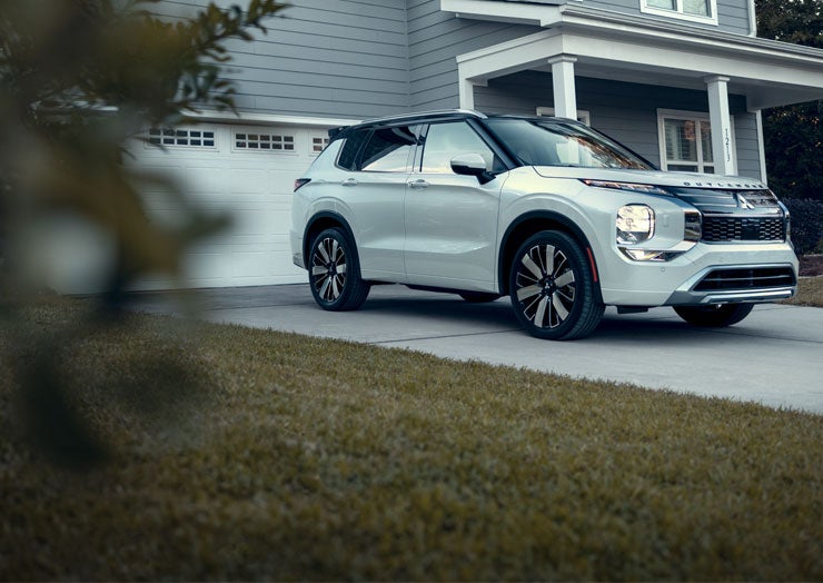Silver 2026 Outlander parked in a driveway